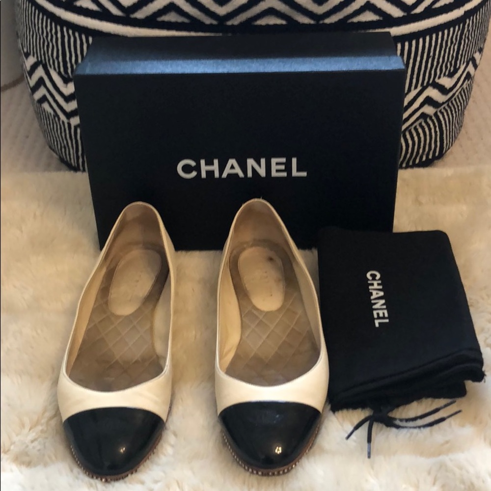 Cream and black Chanel flats